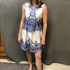 White dress with blue pattern